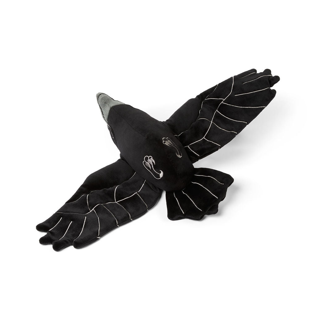 plush raven toy on it's back to show off silver claws on a white background